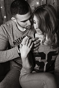 grayscale photo of man and woman in long-sleeved tops