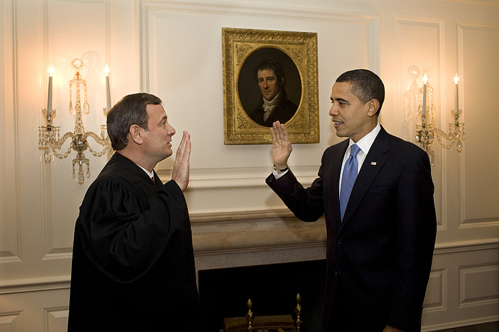 Barack Obama in front of man