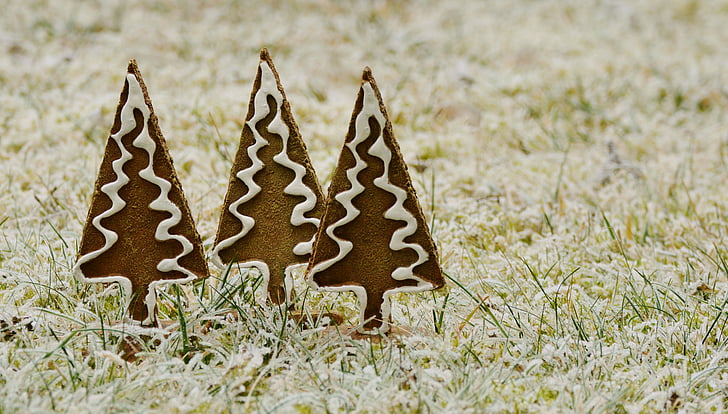 three brown-and-white Christmas tree decors