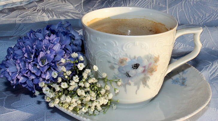 white and purple floral ceramic coffee cup with saucer