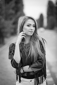 grayscale photography of woman in fringe top