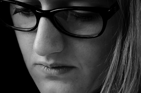 woman wearing black framed eyeglasses