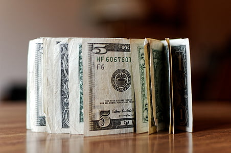closeup photo of bundle of U.S. dollar banknotes