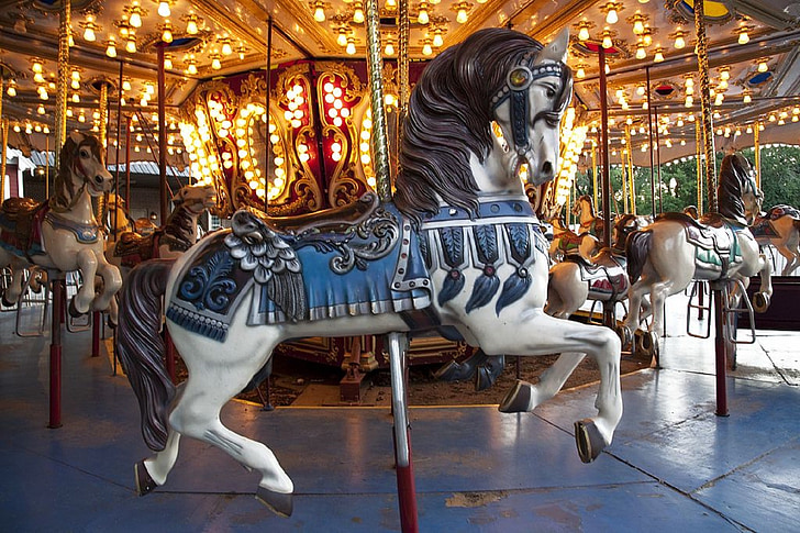 time lapse photograph of horse carousel