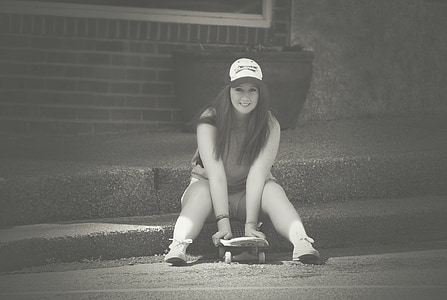 woman holding skateboard