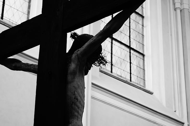 grayscale photography of Jesus Christ with cross statue