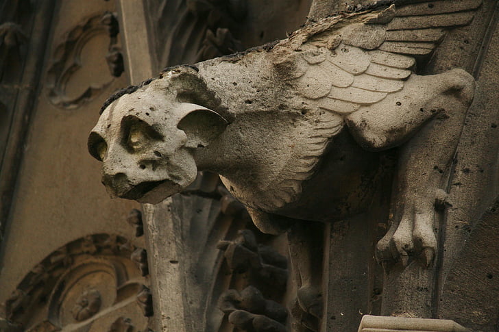 grey winged creature architectural ornament