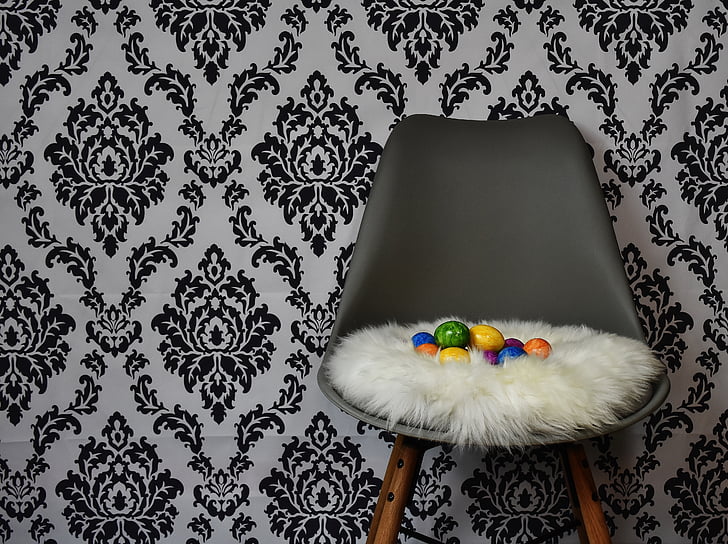 assorted egg decors on gray chair
