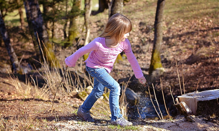 girl about to walk on forest