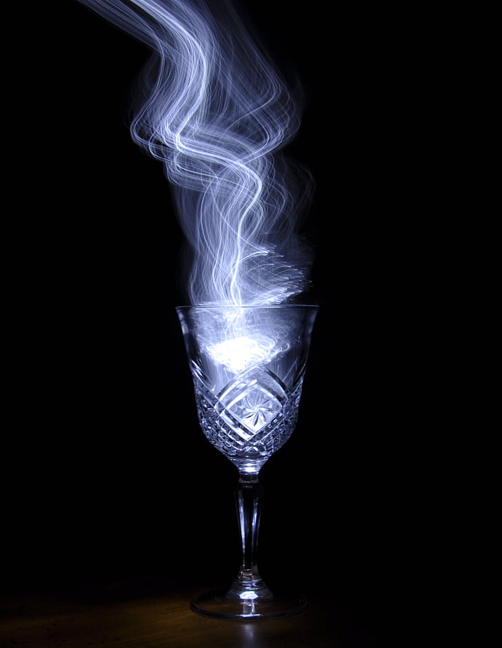 footed glass with smoke