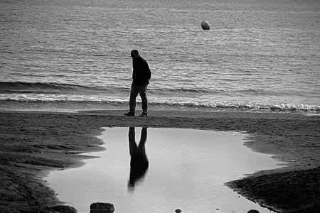 man walking on shore