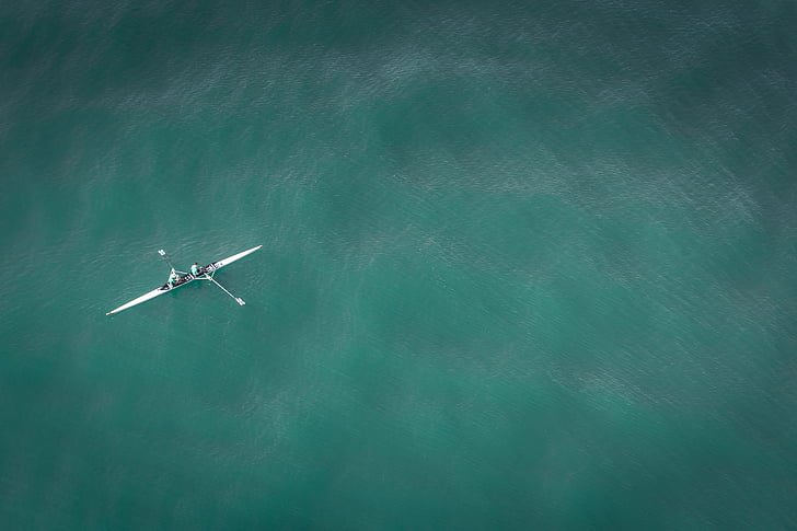 two people riding kayak in ocean