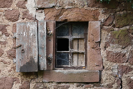 brown window surrounded with wall