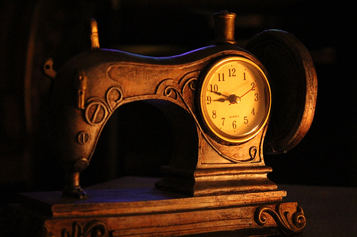 brown analog sewing machine themed clock