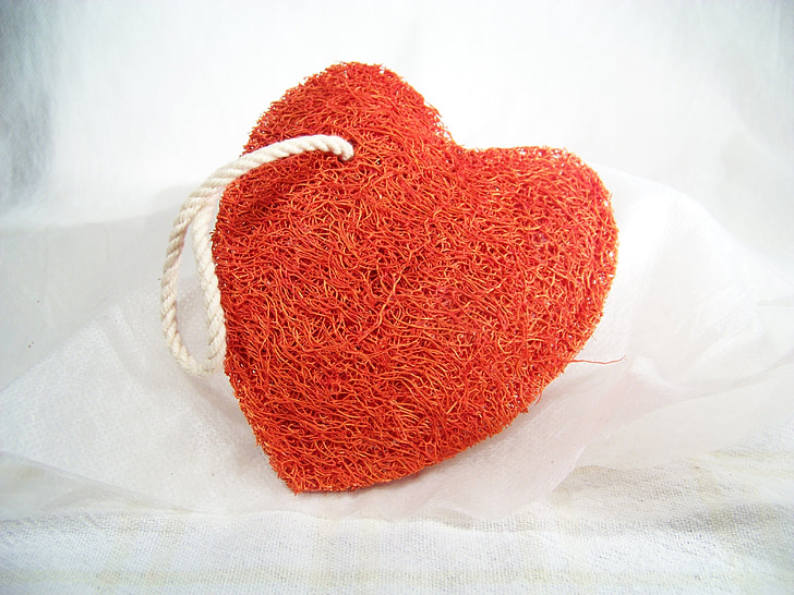 red heart body scrub on white textile
