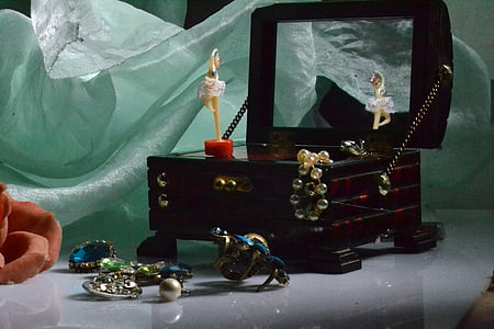 opened black jewelry box with accessories