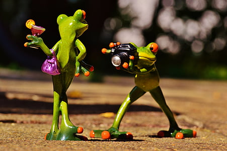 two ceramic frog figurines