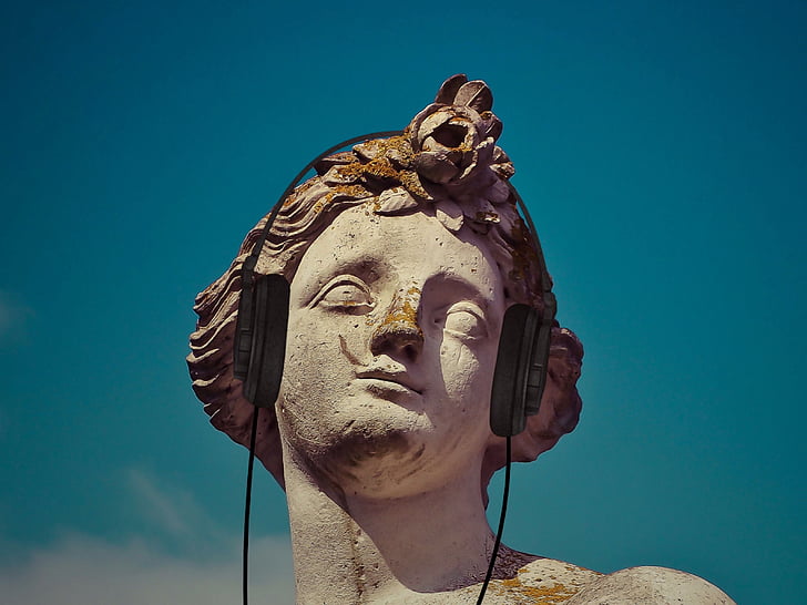 male statue with headphones