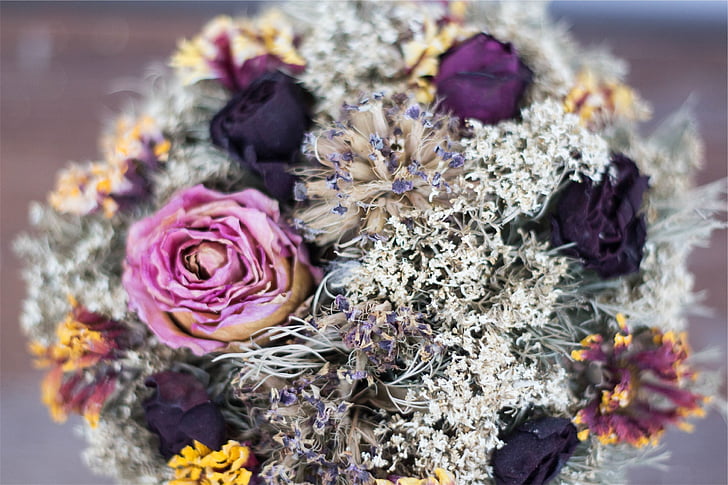 closeup photo of artificial purple flower bouquet