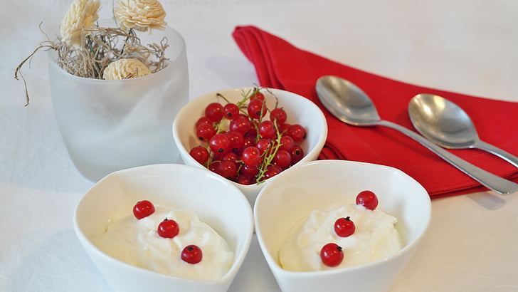 cherries in three white bowls