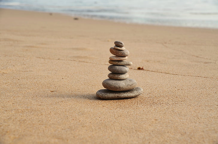 stack of stones near seashore during daytime