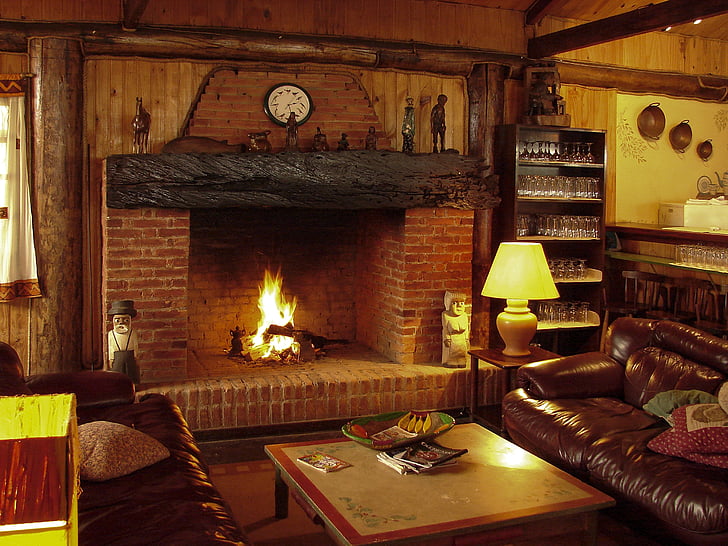 photo of brown and black fireplace