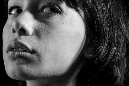 grayscale photograph of woman's face portrait