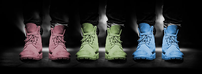 three pairs of pink, green, and blue lace-up high-top shoes