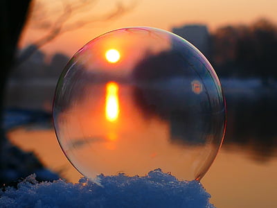 bubble on snow beside body of water