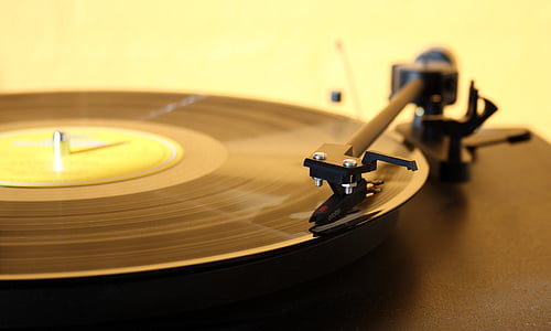 focus photography of black vinyl record player