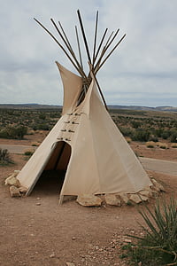 beige and brown outdoor tipi tent at daytime