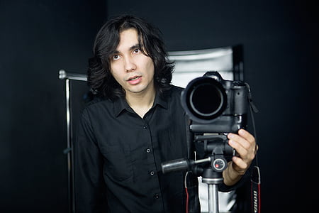 man holding video camera