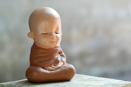 baby monk ceramic figurine