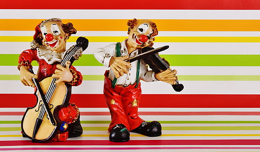 two multicolored musician clown figurines