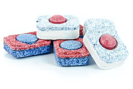 six red-blue-and-white ornaments on white surface
