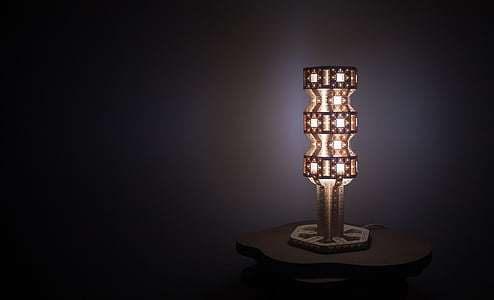 lighted brass-colored table lamp