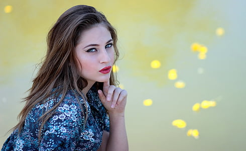 selective focus photography of woman wearing blue and black top