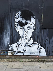 boy pointing his nos graffiti