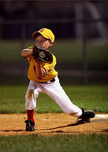 boy catching baseball