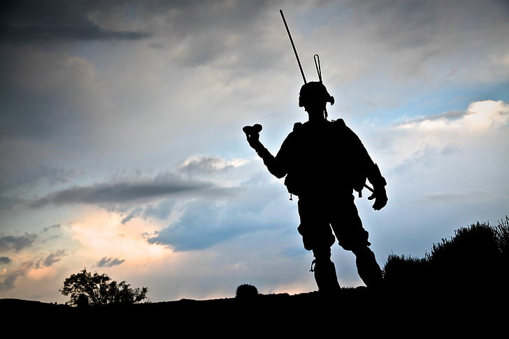 soldier standing during sunset