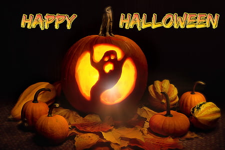 ghost carved pumpkin with Happy Halloween text overlay
