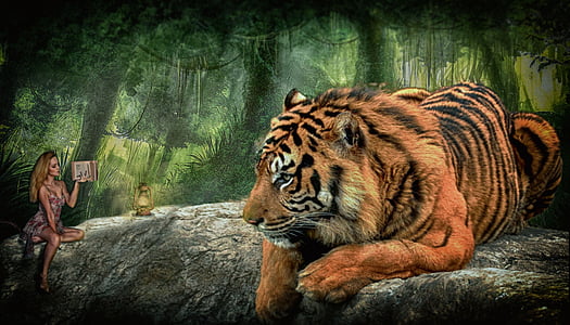 woman sitting beside tiger painting