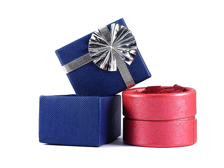 two blue gift box beside red box against white background