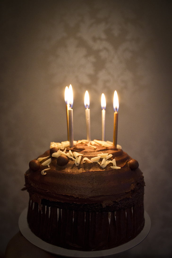 chocolate cake with five candles