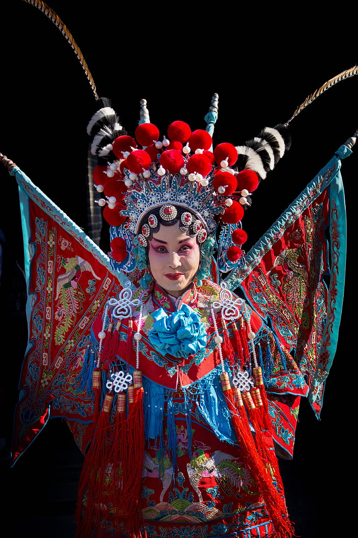 woman wearing red and teal costume