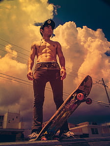 man in denim jeans with skateboard