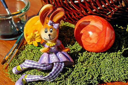 rabbit figurine near brown basket