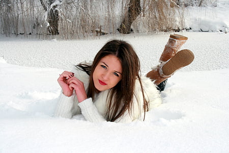 woman wearing white winter coat posing at camera