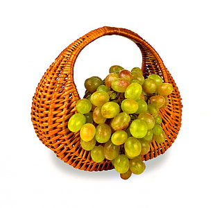 brown wicker basket with green grapes