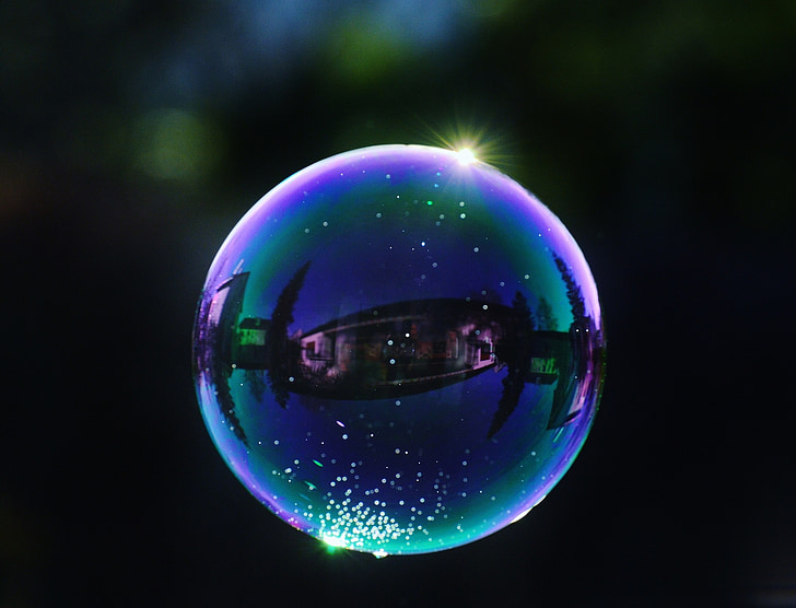 selective focus photography of bubbles at night time